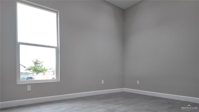 unfurnished room featuring light wood-type flooring