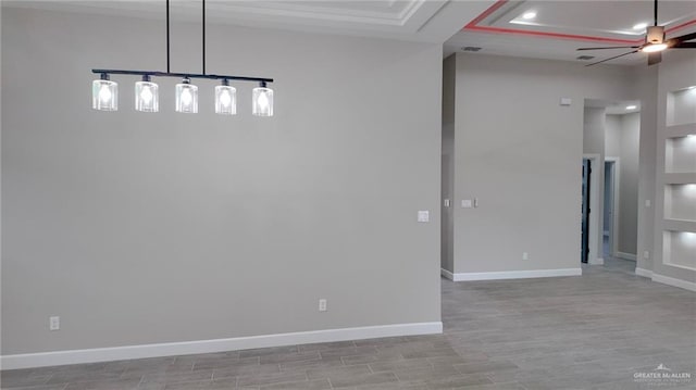 spare room featuring ceiling fan and light hardwood / wood-style floors