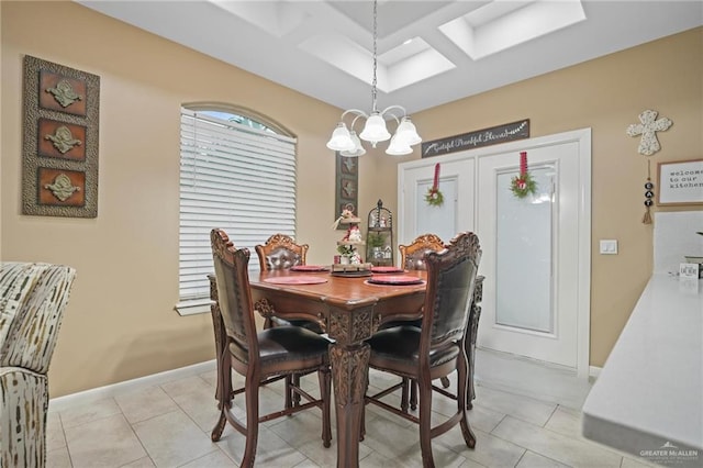 tiled dining space with beam ceiling, a chandelier, and coffered ceiling