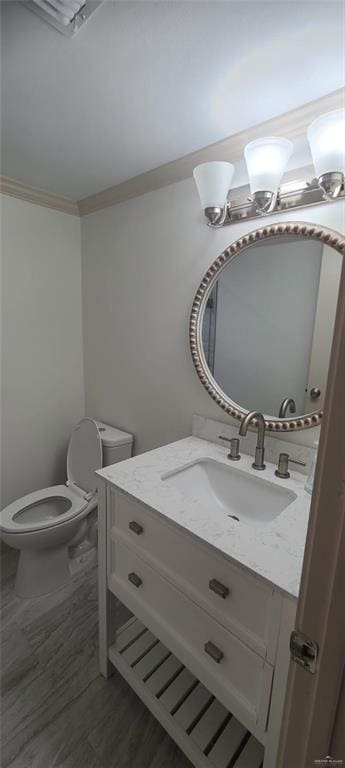 bathroom featuring hardwood / wood-style floors, vanity, and toilet