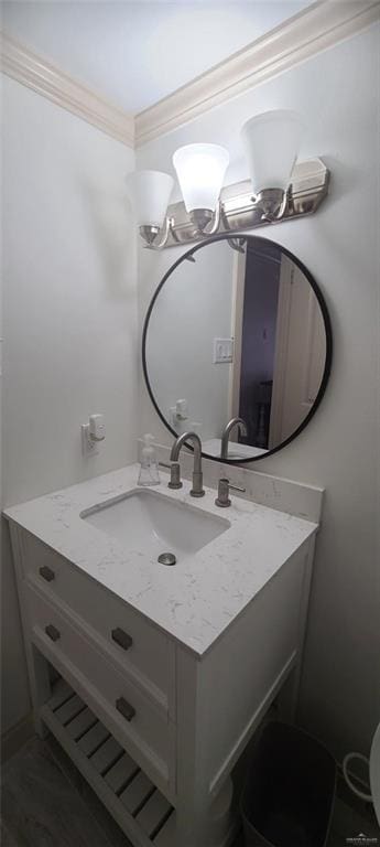 bathroom featuring crown molding and vanity