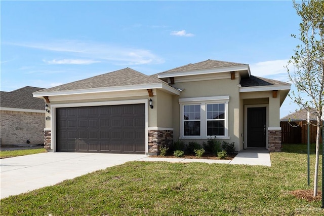 prairie-style home with a front yard and a garage