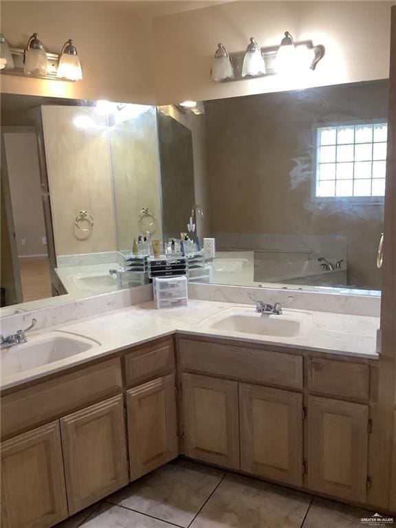 bathroom with tile patterned flooring and vanity