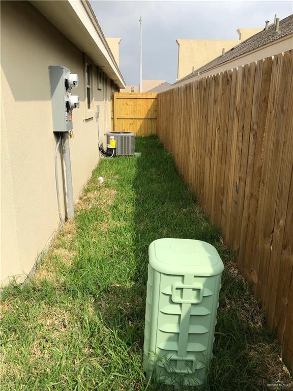 view of yard featuring central AC unit