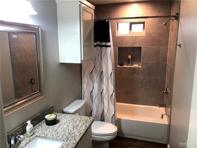 full bathroom with vanity, toilet, and shower / tub combo with curtain