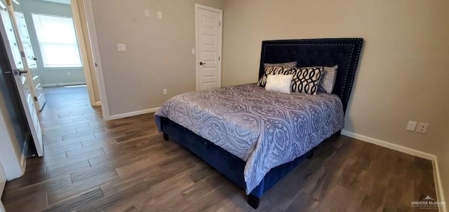 bedroom featuring dark hardwood / wood-style flooring