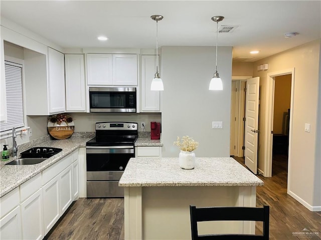 kitchen with dark hardwood / wood-style floors, sink, white cabinetry, and stainless steel appliances