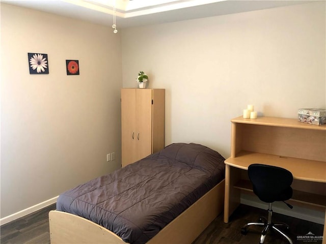 bedroom featuring dark wood-type flooring