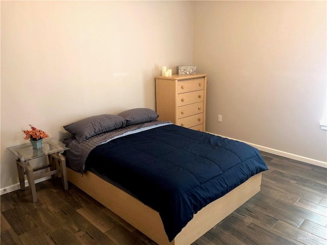 bedroom featuring dark hardwood / wood-style flooring