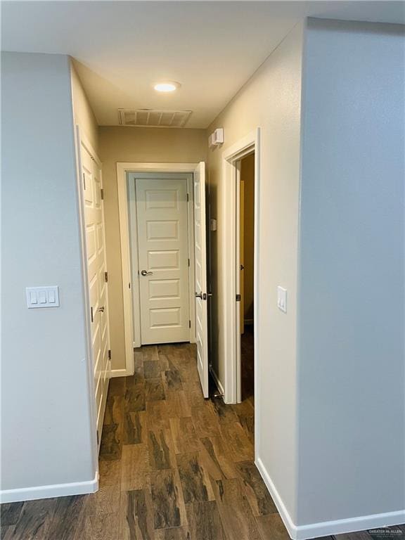 corridor featuring dark hardwood / wood-style flooring