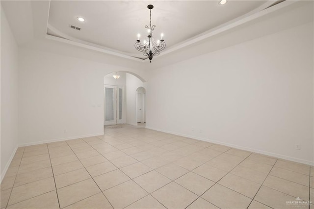 507 Edgewood Ave, Edinburg, TX 78541 - spare room with a raised ceiling, recessed lighting, a chandelier, and arched walkways