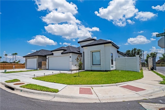 view of front facade with a front yard and a garage