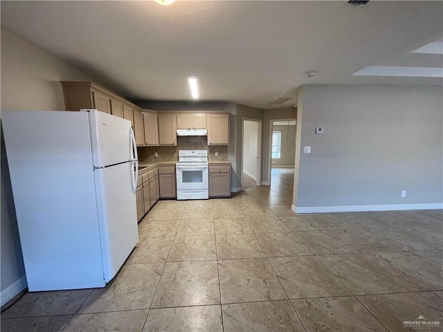 kitchen with light countertops, backsplash, white appliances, under cabinet range hood, and baseboards