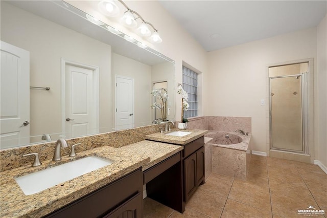 304 N 18th St, Hidalgo, TX 78557 - bathroom featuring double vanity, a garden tub, a stall shower, and tile patterned floors