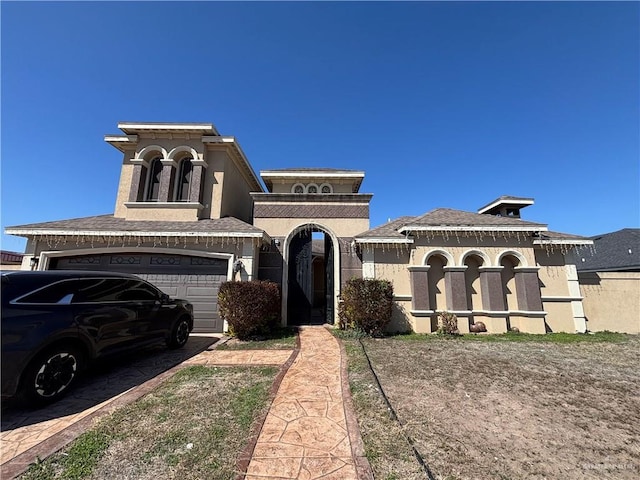 mediterranean / spanish-style house featuring an attached garage