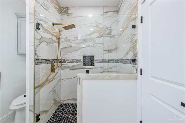 bathroom with toilet and a marble finish shower