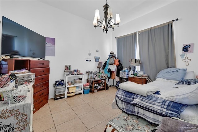 tiled bedroom featuring a notable chandelier