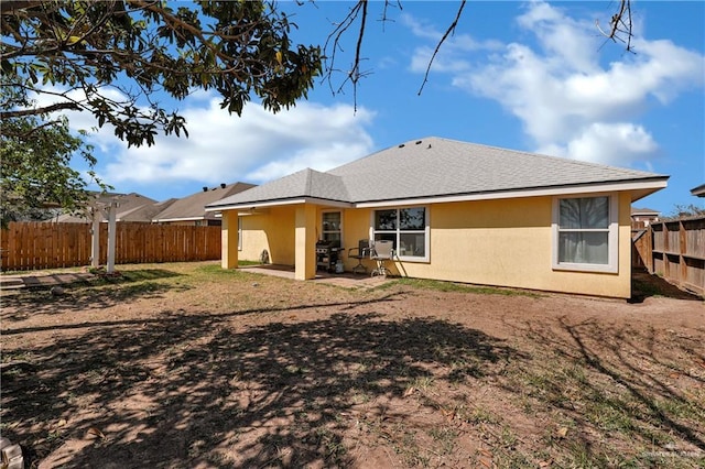 back of property featuring a patio, fence, and stucco siding