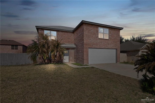 3400 Ozark Ave, Mcallen, TX 78504 - traditional home with a garage, fence, concrete driveway, and a lawn