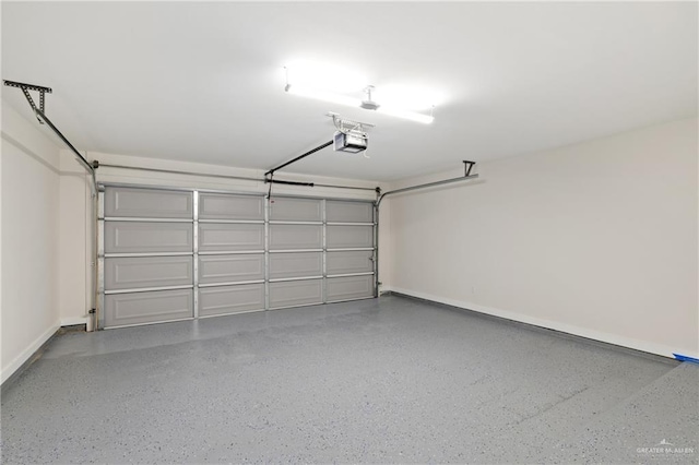 3400 Ozark Ave, Mcallen, TX 78504 - garage featuring a garage door opener and baseboards
