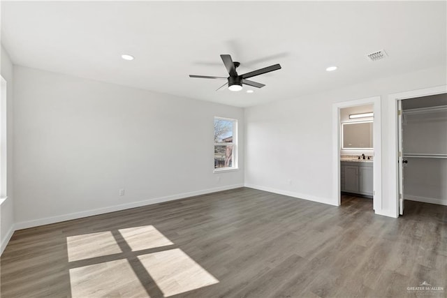 3400 Ozark Ave, Mcallen, TX 78504 - unfurnished bedroom with recessed lighting, ensuite bathroom, baseboards, and wood finished floors