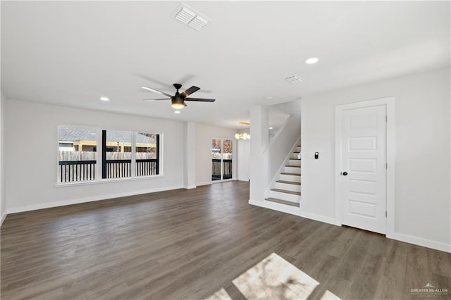 3400 Ozark Ave, Mcallen, TX 78504 - unfurnished living room featuring baseboards, stairway, visible vents, ceiling fan with notable chandelier, and wood finished floors