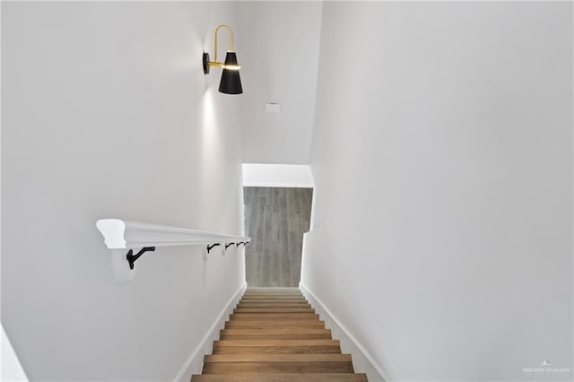 3400 Ozark Ave, Mcallen, TX 78504 - staircase featuring wood finished floors and baseboards