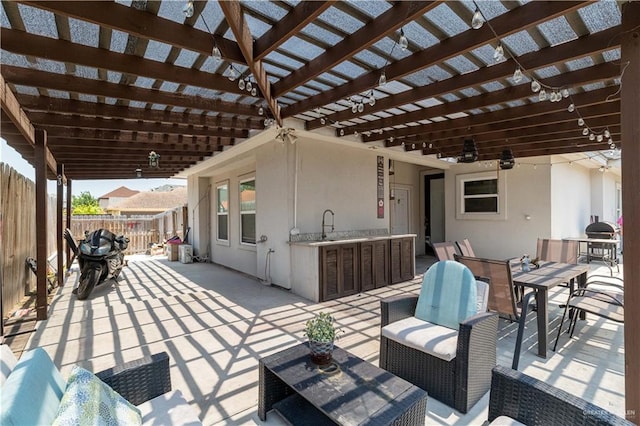 4000 Eucaliptus Ave, Mcallen, TX 78501 - view of patio / terrace featuring outdoor dining area, a pergola, a ceiling fan, and a sink