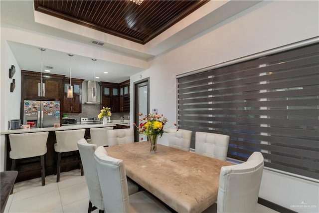 4000 Eucaliptus Ave, Mcallen, TX 78501 - dining room with a tray ceiling, light tile patterned flooring, and wooden ceiling