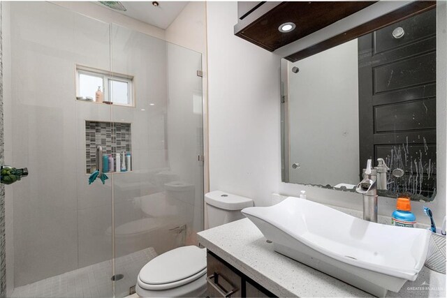 4000 Eucaliptus Ave, Mcallen, TX 78501 - bathroom with toilet, a stall shower, and vanity