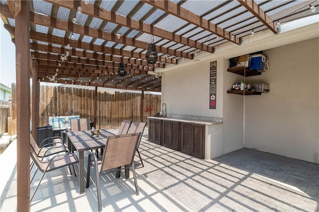 4000 Eucaliptus Ave, Mcallen, TX 78501 - view of patio with a pergola, outdoor dining area, and a sink