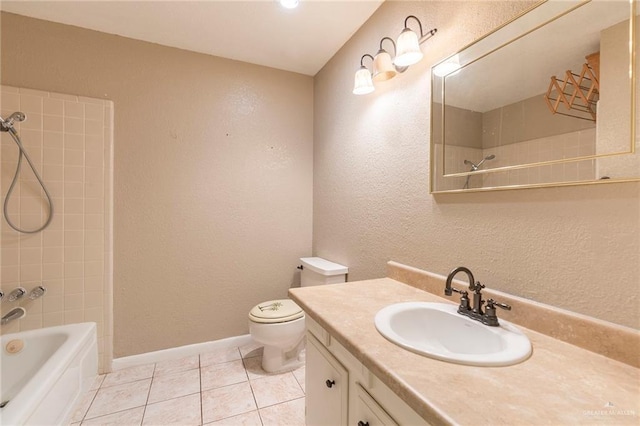 full bathroom with tile patterned floors, toilet, tiled shower / bath combo, and vanity