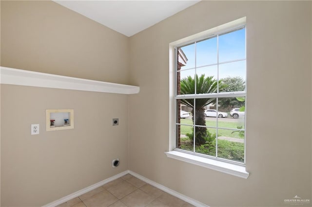 1730 W Jefferson St, Weslaco, TX 78599 - washroom featuring hookup for an electric dryer, washer hookup, healthy amount of natural light, and baseboards
