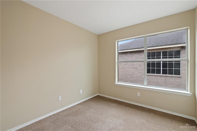 1730 W Jefferson St, Weslaco, TX 78599 - carpeted empty room featuring baseboards