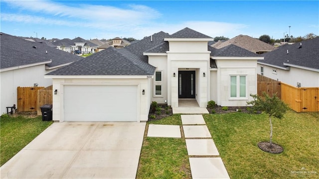 3100 E Zinnia Ave, Alton, TX 78573 - view of front of house with roof with shingles, an attached garage, driveway, and a residential view