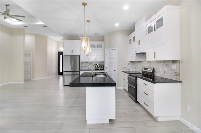 3100 E Zinnia Ave, Alton, TX 78573 - kitchen with appliances with stainless steel finishes, dark countertops, a sink, decorative backsplash, and ceiling fan