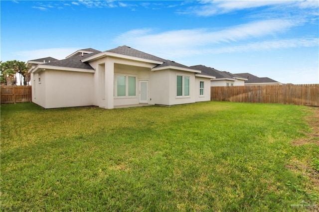3100 E Zinnia Ave, Alton, TX 78573 - back of house with stucco siding and a shingled roof