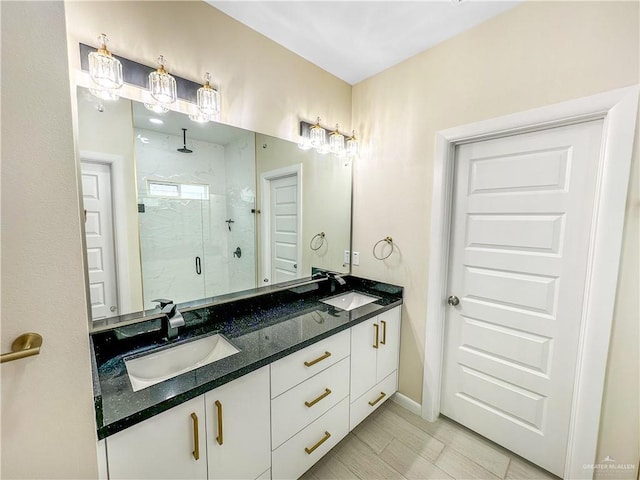 3100 E Zinnia Ave, Alton, TX 78573 - bathroom featuring double vanity, a marble finish shower, and baseboards