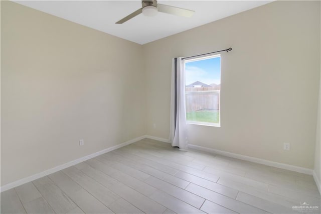3100 E Zinnia Ave, Alton, TX 78573 - unfurnished room featuring a ceiling fan, light wood finished floors, and baseboards