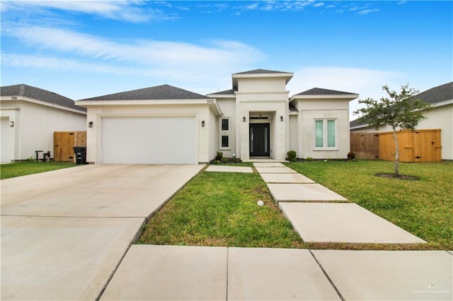 3100 E Zinnia Ave, Alton, TX 78573 - prairie-style house featuring a garage, stucco siding, and concrete driveway