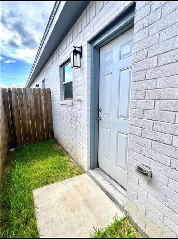 entrance to property with a patio area