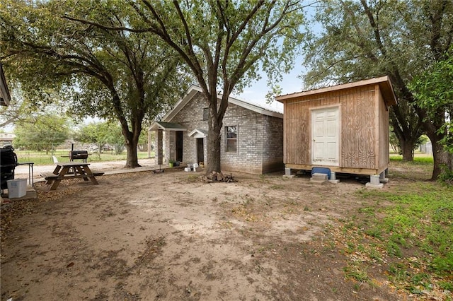 exterior space with an outbuilding and fence