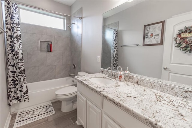 full bathroom with vanity, toilet, and shower / bath combo with shower curtain