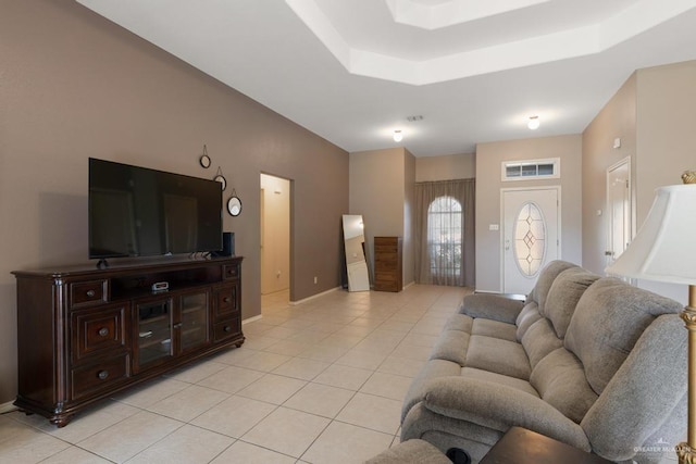 tiled living room with a raised ceiling