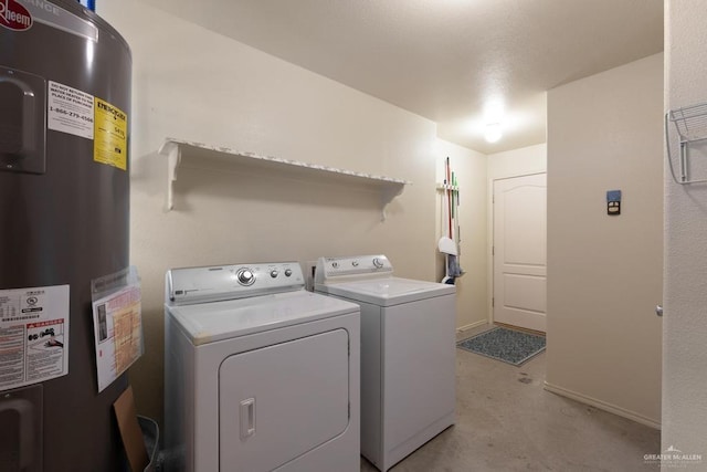 laundry room featuring separate washer and dryer and water heater