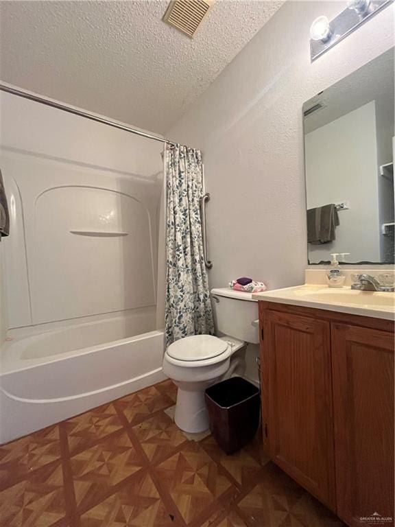 full bathroom with shower / bath combo, vanity, toilet, parquet flooring, and a textured ceiling