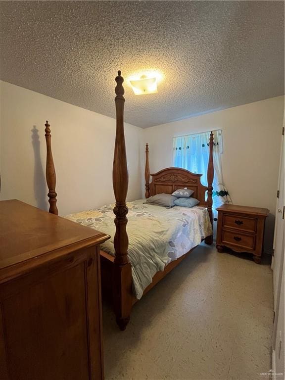 bedroom featuring a textured ceiling