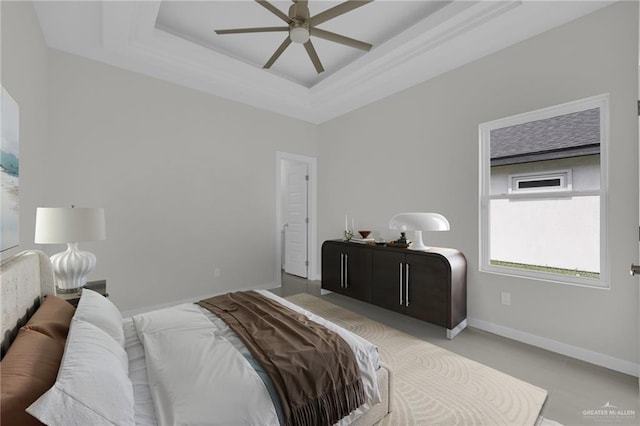 1015 Magnolia St, Mission, TX 78573 - bedroom featuring a tray ceiling, baseboards, and ceiling fan