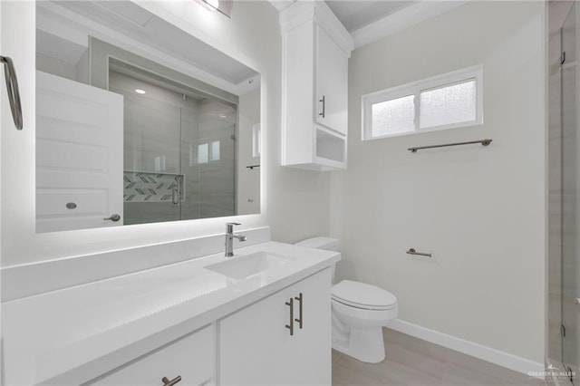 1015 Magnolia St, Mission, TX 78573 - full bathroom with vanity, a stall shower, toilet, and baseboards
