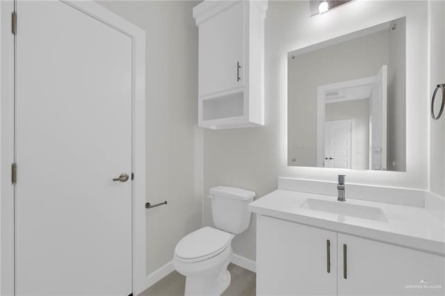 1015 Magnolia St, Mission, TX 78573 - half bath with toilet, vanity, and baseboards